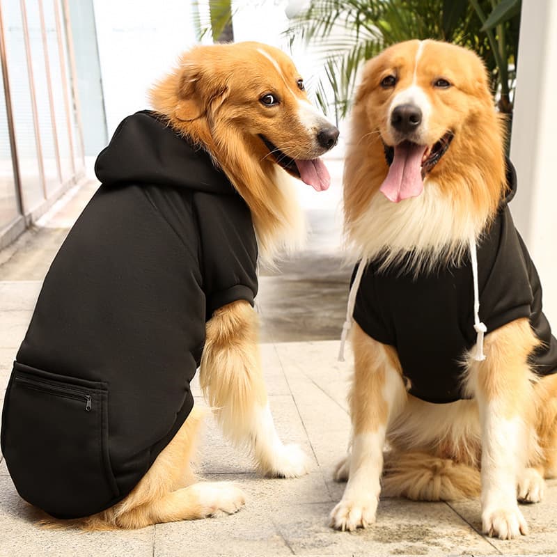 Two dogs wearing Black Extra Warm Fleece Dog Hoodies