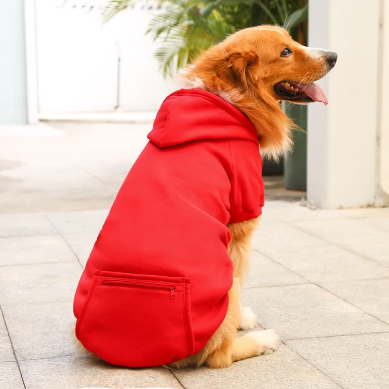 A dog wearing a Red Extra Warm Fleece Dog Hoodie