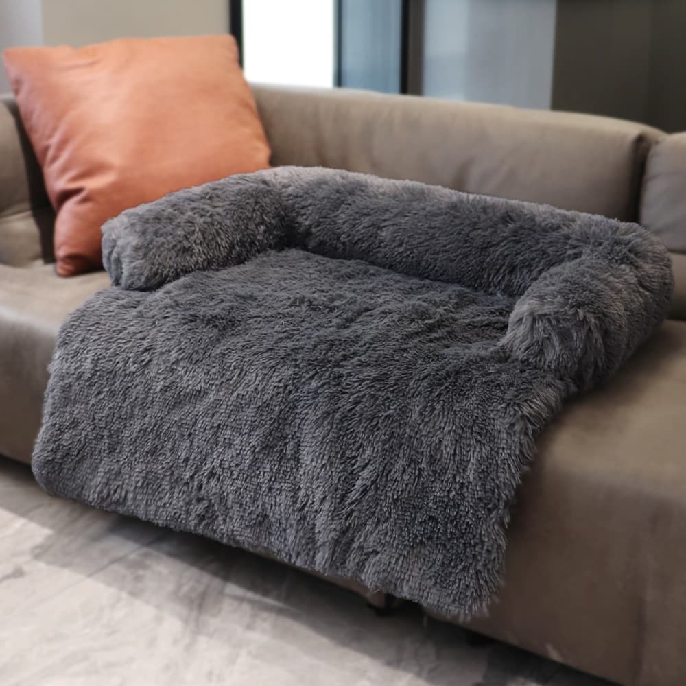 Calming Cuddle Furniture Protector Charcoal variant placed on a couch