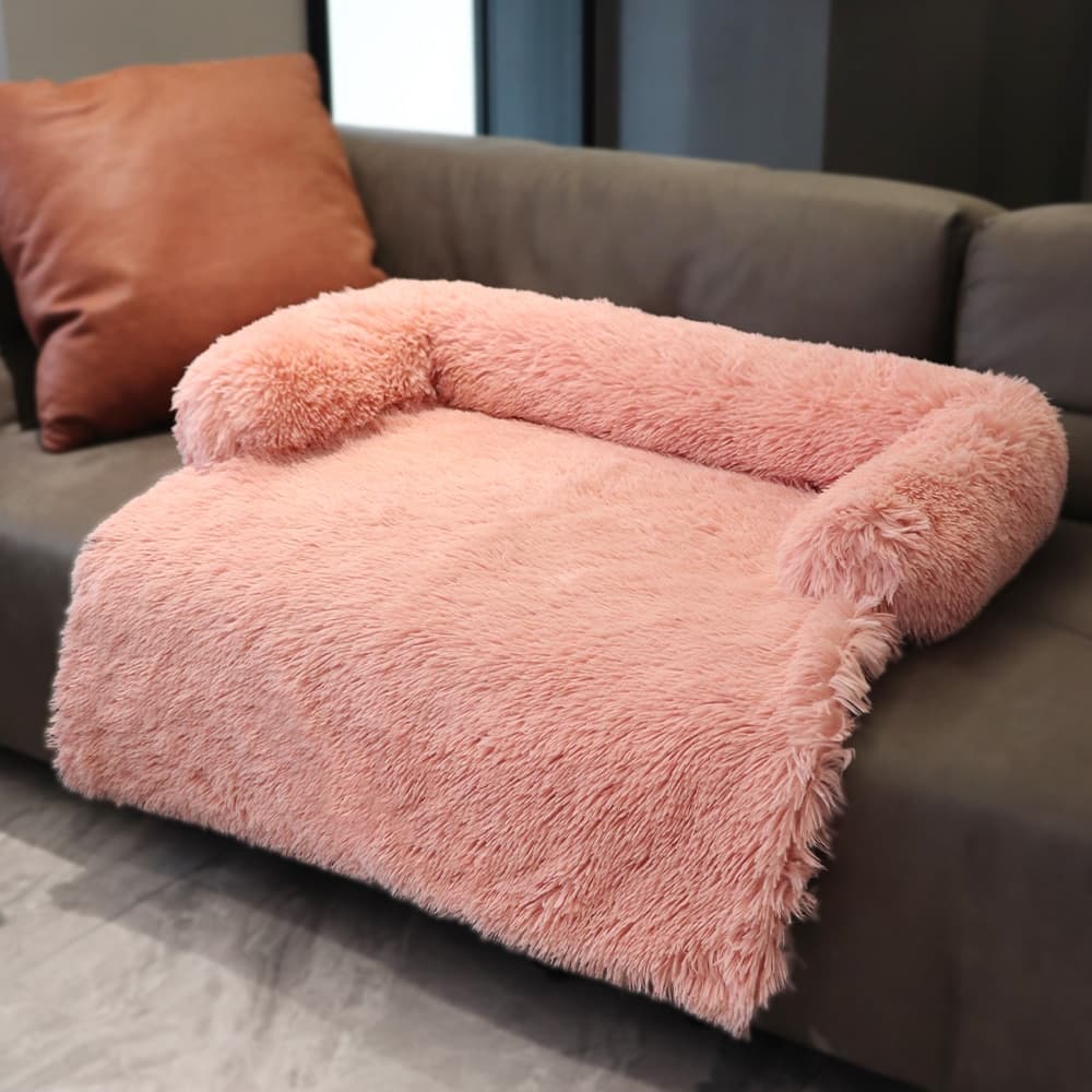 Calming Cuddle Furniture Protector Pink variant placed on a couch