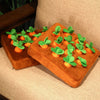 Two Carrot Field Snuffle Toys on a couch