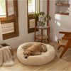 Load image into Gallery viewer, Golden Retriever resting on an Apricot Calming Cuddle Bed