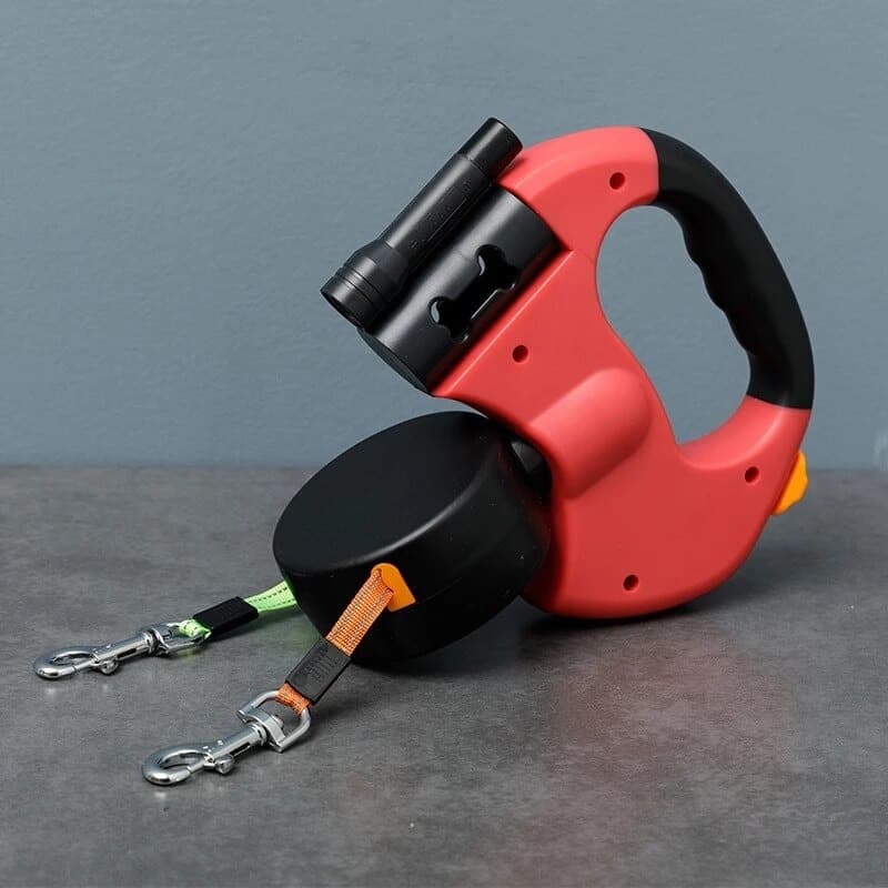 Red Double Retractable Leash placed on a gray counter